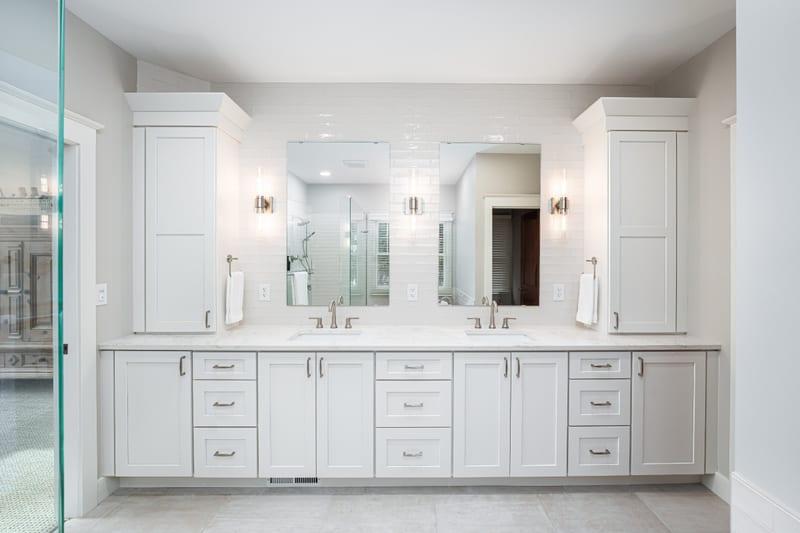 Luxury bathroom — white shaker double vanity, marble countertops, brushed nickel fixtures
