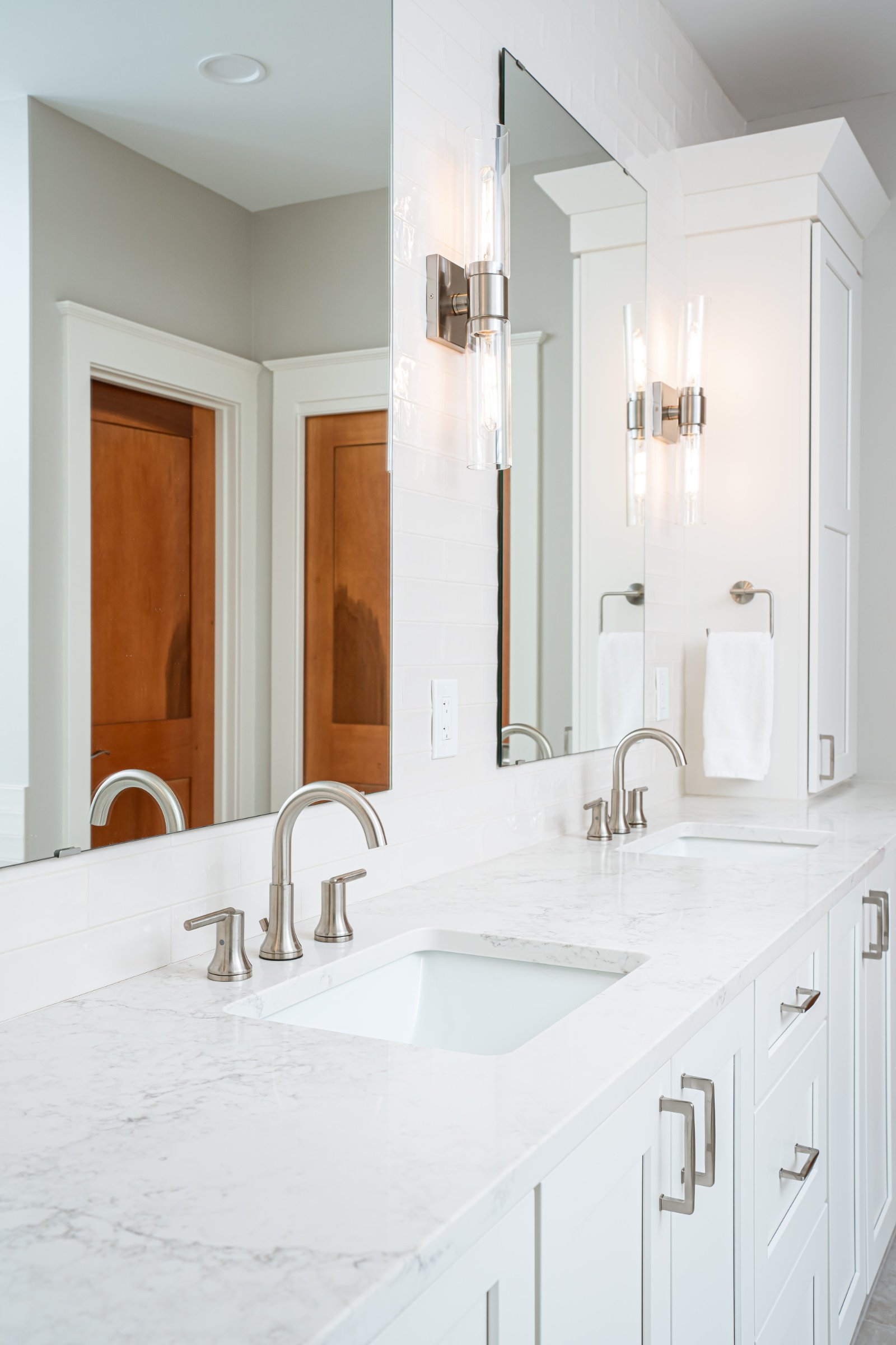 Spa Sanctuary bathroom — frameless glass walk-in shower with marble tile
