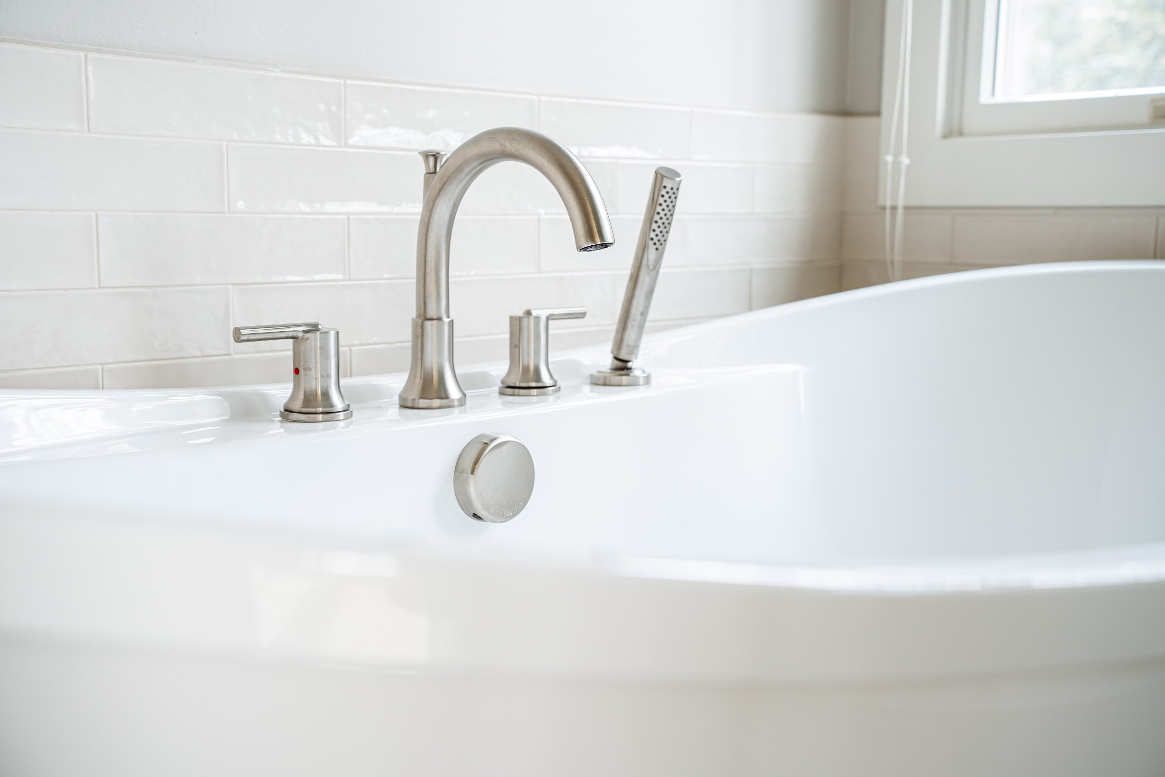 Spa Sanctuary bathroom — soaking tub and marble tile detail