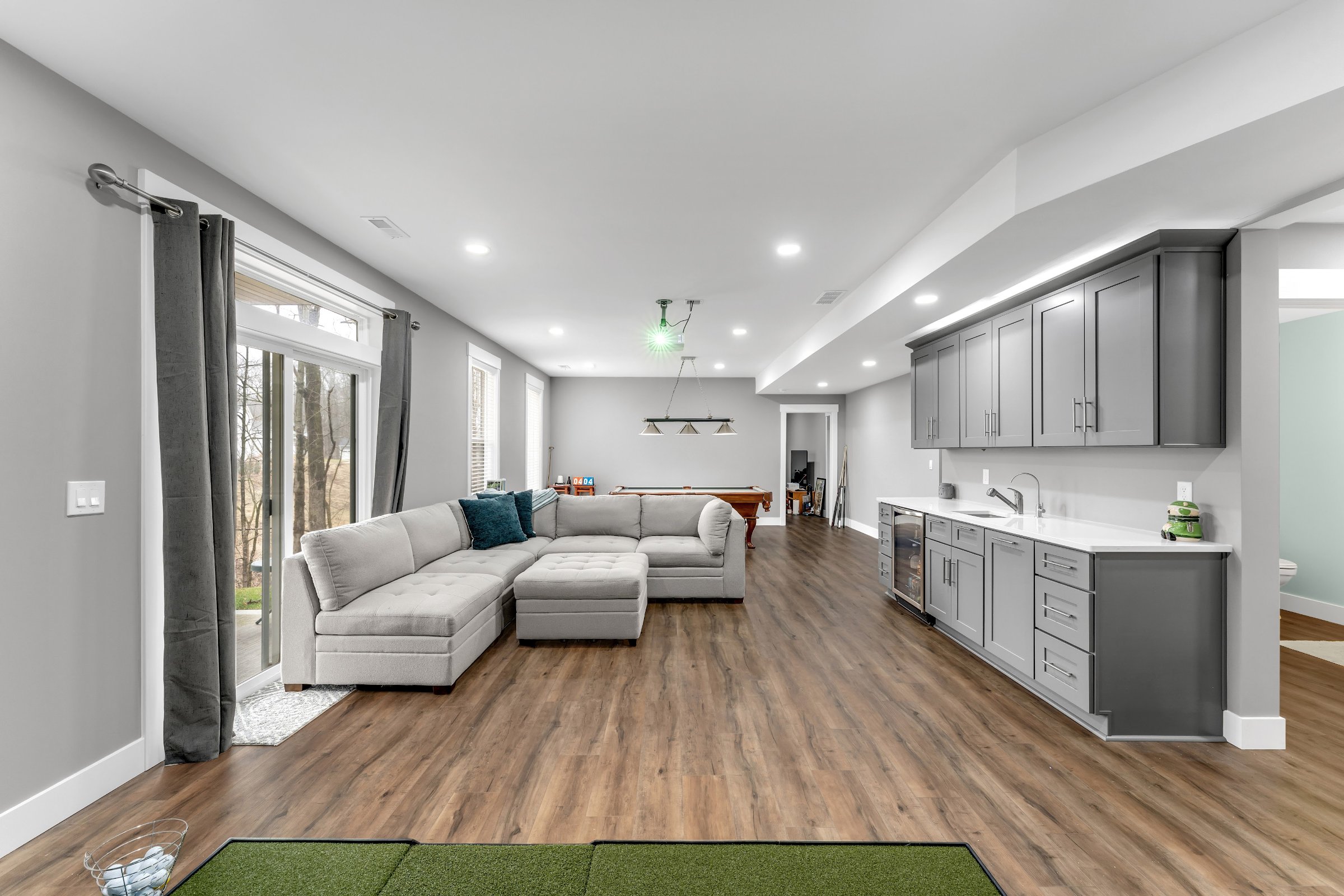 Luxury entertainment basement wide view