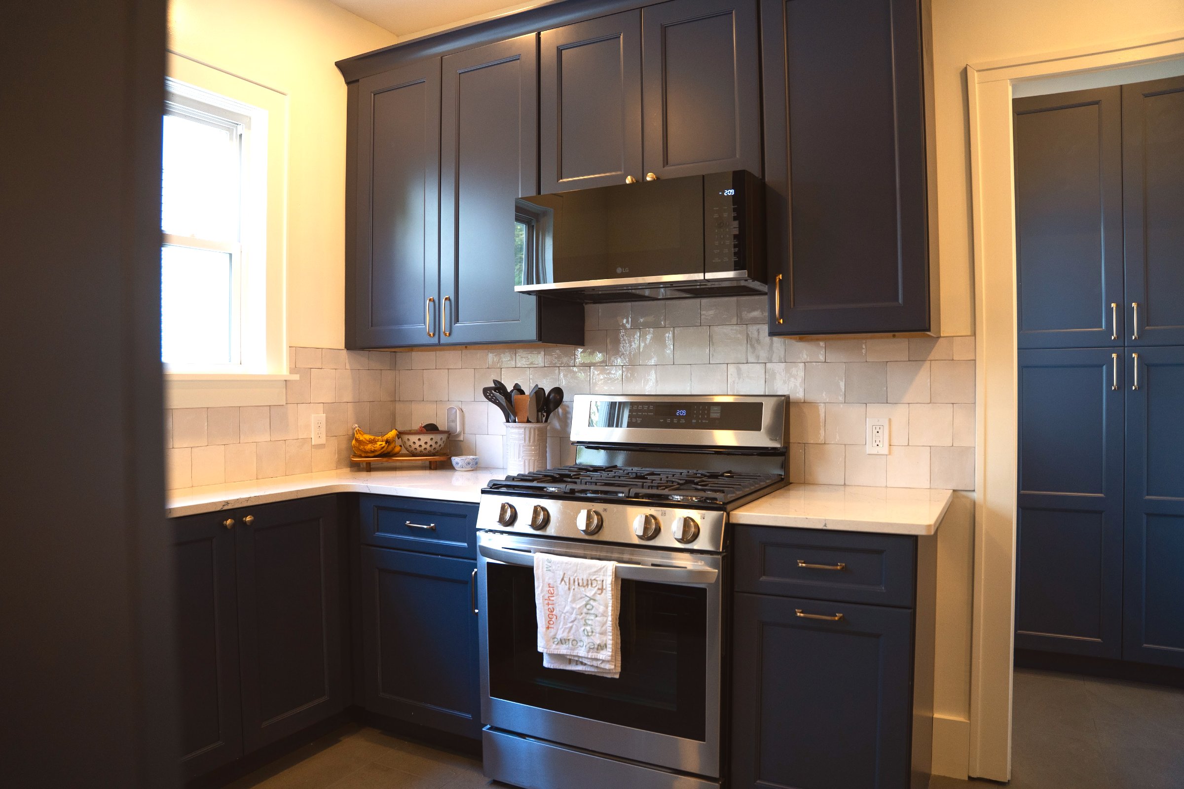 Navy & Gold kitchen detail — gold hardware on navy shaker cabinet