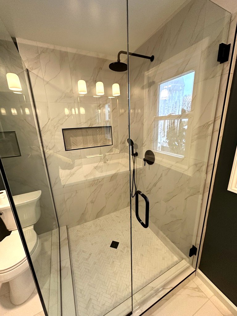 Modern Sophistication bathroom — dark sophisticated palette with porcelain and marble textures