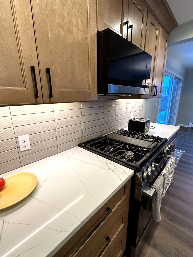 Woodland Escape bathroom detail — matte black fixture and gold accent close-up