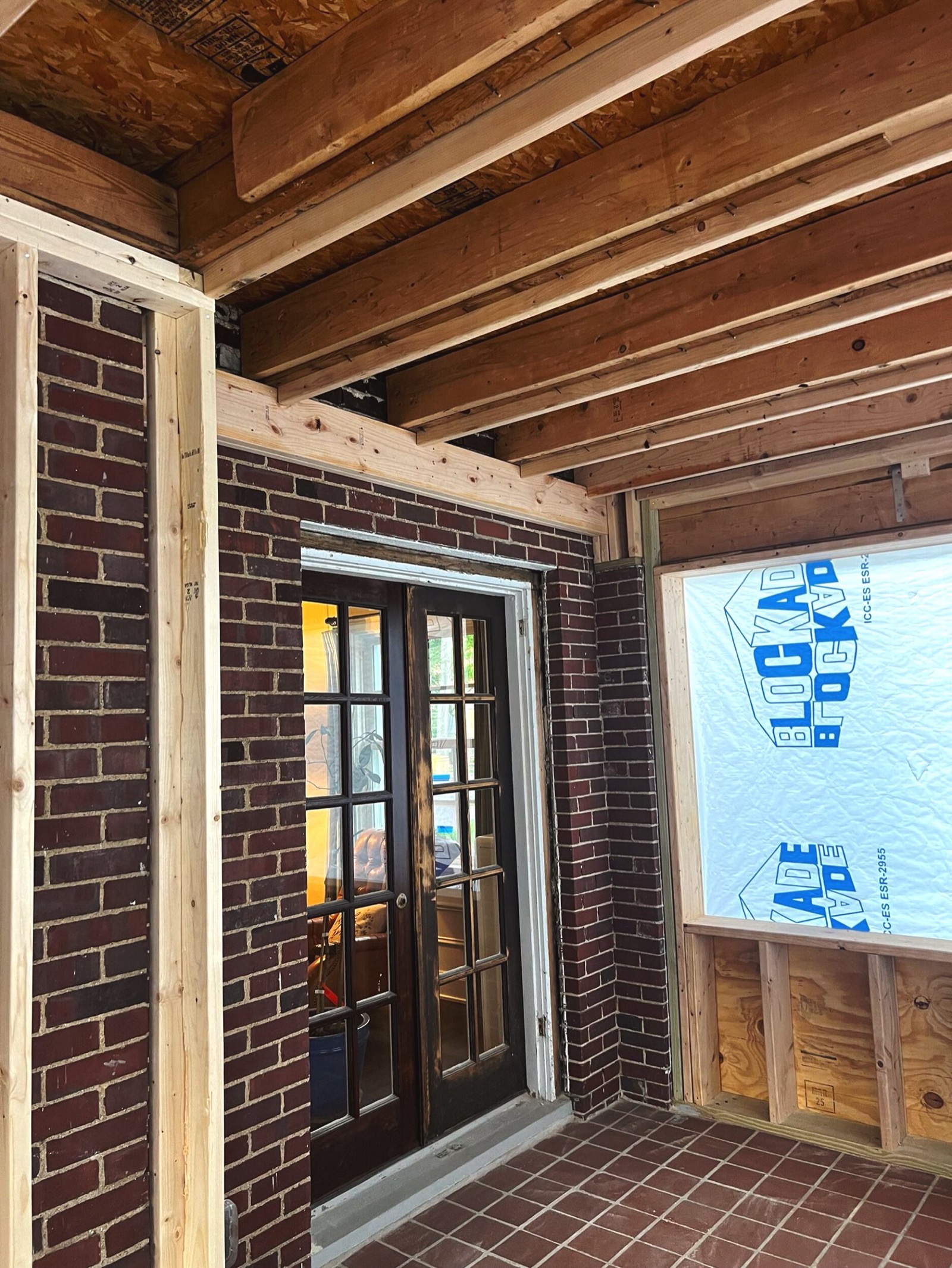 Heritage office addition — before: historic brick Colonial exterior